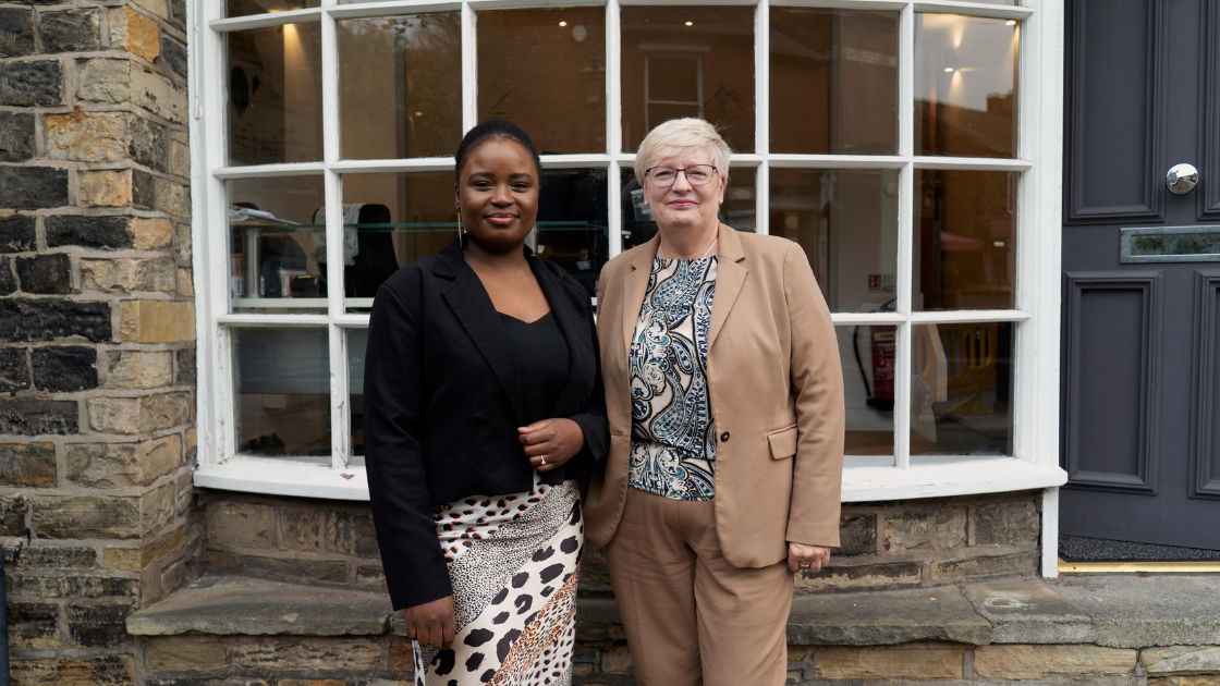 Photo of Dammy Uthman, Paralegal and Valerie Chirnside, Legal Assistant at Bridge Law's head office, Marple Bridge.
